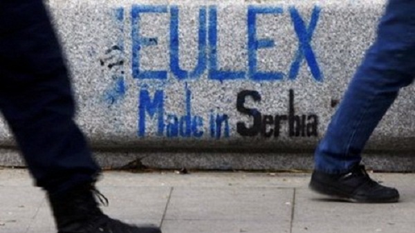 epa01563034  Kosovo Albanian men walk past graffiti reading ' EULEX Made in Serbia ' in Pristina, Kosovo, 28 November 2008. The U.N. Security Council cleared the way on Wednesday for a European Union police and justice mission, EULEX, to deploy in Kosovo, in a statement welcoming agreement by Serbia and Kosovo to the move. Kosovo has rejected elements of a six-point plan put forward by Mr Ban on the grounds it would imply a partition of the country between its 90 per cent ethnic Albanian majority and minority Serb areas in the north.  EPA/VALDRIN XHEMAJ
