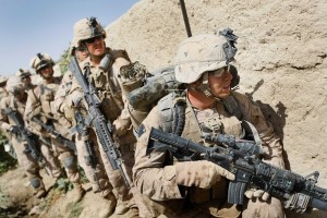 MAIN POSHTEH, AFGHANISTAN  - JULY 02:  U.S. Marines from 2nd Marine Expeditionary Brigade, RCT 2nd Battalion 8th Marines Echo Co. prepare to search a building during the start of Operation Khanjari on July 2, 2009 in Main Poshteh, Afghanistan. The Marines are part of an operation to take areas in the Southern Helmand Province that Taliban fighters are using as a resupply route and to help the local Afghan population prepare for the upcoming presidential elections.  (Photo by Joe Raedle/ Getty Images)