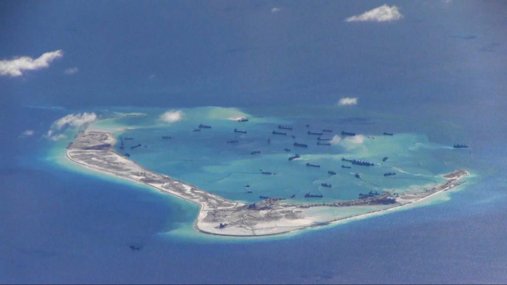 Chinese dredging vessels are purportedly seen in the waters around Mischief Reef in the disputed Spratly Islands in the South China Sea, May 21, 2015.  REUTERS/U.S. Navy