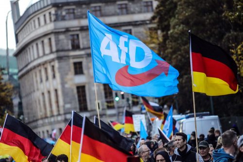 BERLIN, GERMANY - OCTOBER 08: People march to protest against the rising cost of living in a demonstration organized by the right-wing Alternative for Germany (AfD) political party on October 8, 2022 in Berlin, Germany. Consequences stemming from Russia's ongoing war in Ukraine have caused fuel prices and inflation to rise dramatically since February, creating a fresh topic for right-wing politicians in Germany to rally support in protests against the government. (Photo by Omer Messinger/Getty Images)