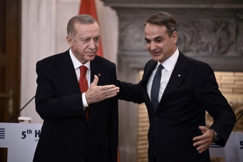 Turkish President Recep Tayyip Erdogan (L) and Greek Prime Minister Kyriakos Mitsotakis leave after speaking to the press following their meeting during Erdogan's official visit to Greece, in Athens, on December 7, 2023. The Turkish president is in Athens on December 7 in a keenly watched visit billed as an attempted "new chapter" between the NATO allies and historic rivals after years of tension. (Photo by Angelos Tzortzinis / AFP)